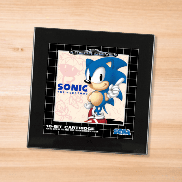 Black glass Sonic the Hedgehog coaster on a wood table