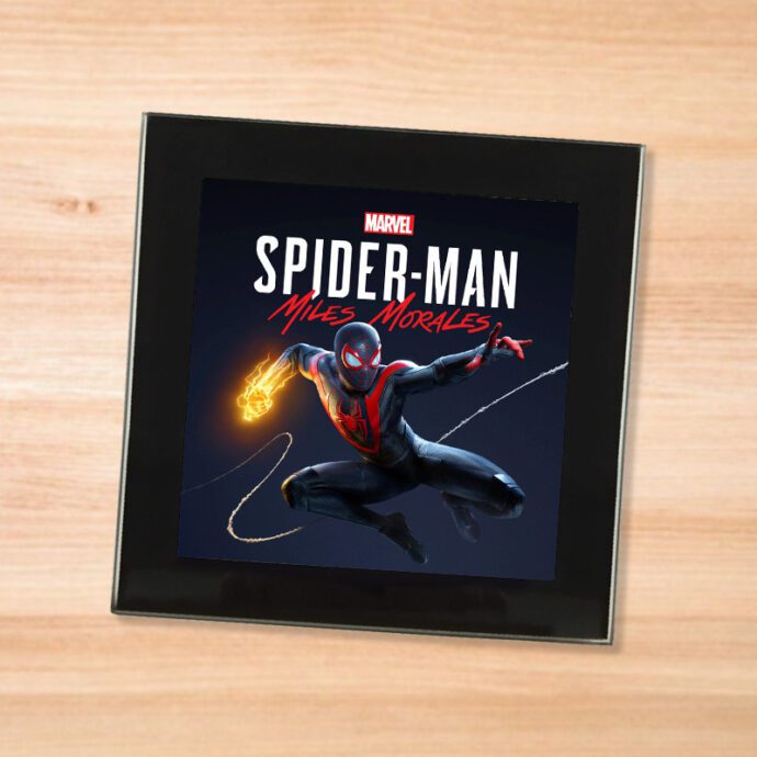 Black glass Spider-Man Miles Morales coaster on a wood table