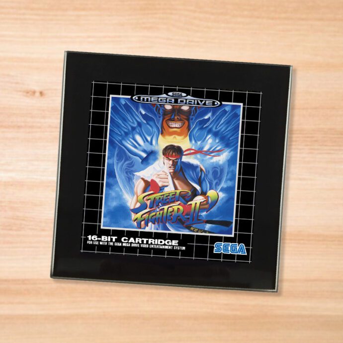 Black glass Street Fighter 2 coaster on a wood table