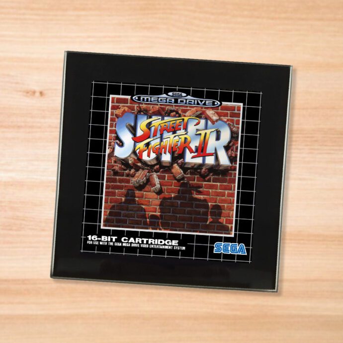 Black glass Street Fighter 2 coaster on a wood table