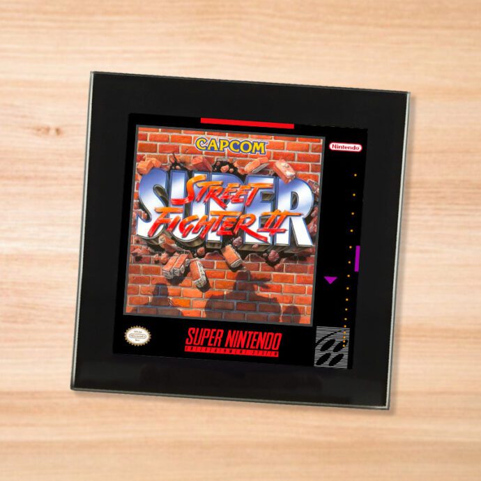 Black glass Street Fighter2 coaster on a wood table
