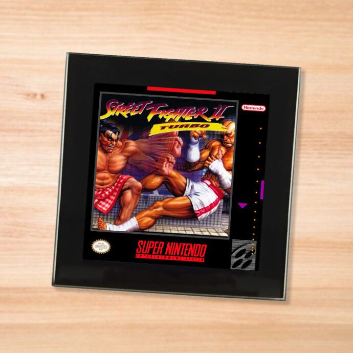 Black glass Street Fighter 2 Turbo coaster on a wood table