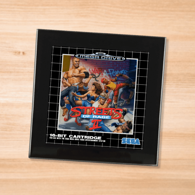 Black glass Streets of Rage 2 coaster on a wood table