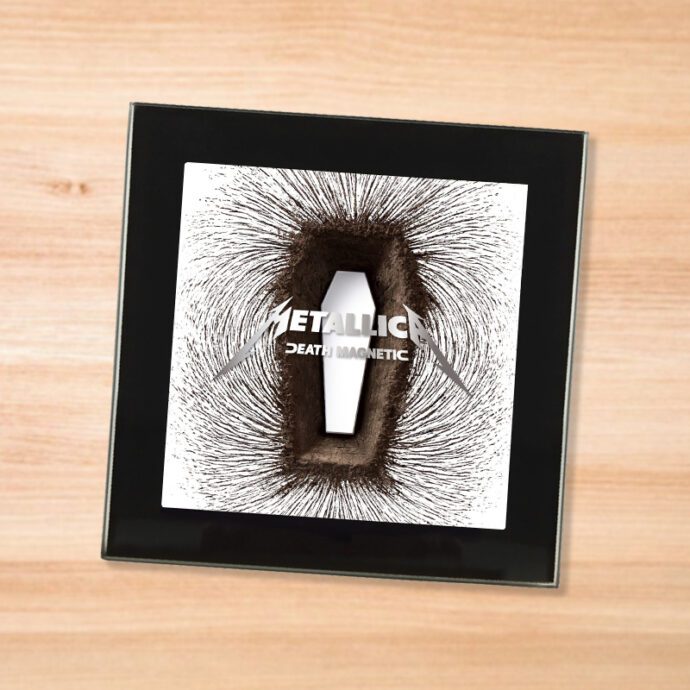 Black glass Metallica - Death Magnetic coaster on a wood table
