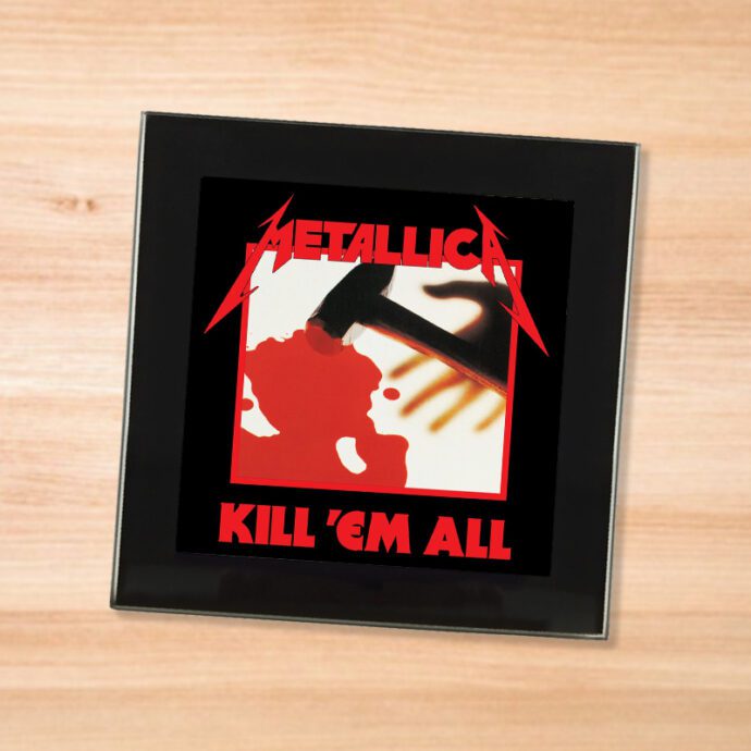 Black glass Metallica - Kill Em All coaster on a wood table
