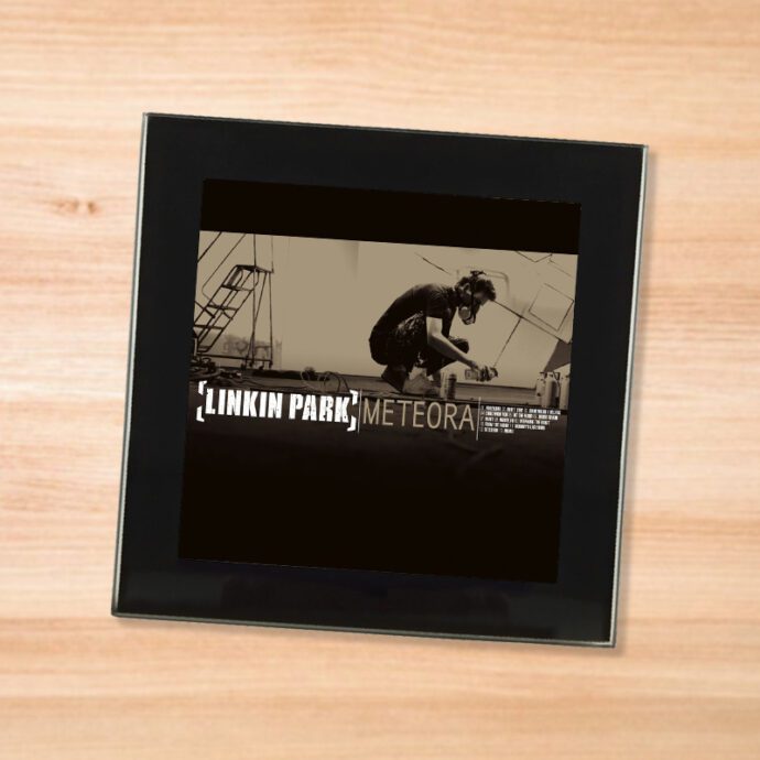 Black glass Linkin Park - Meteora coaster on a wood table