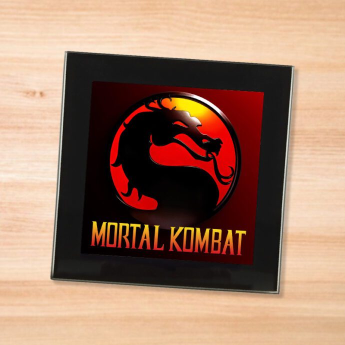 Black glass Mortal Kombat coaster on a wood table