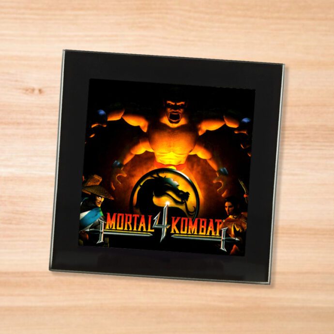 Black glass Mortal Kombat 4 coaster on a wood table