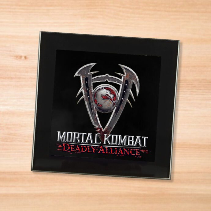Black glass Mortal Kombat Deadly Alliance coaster on a wood table