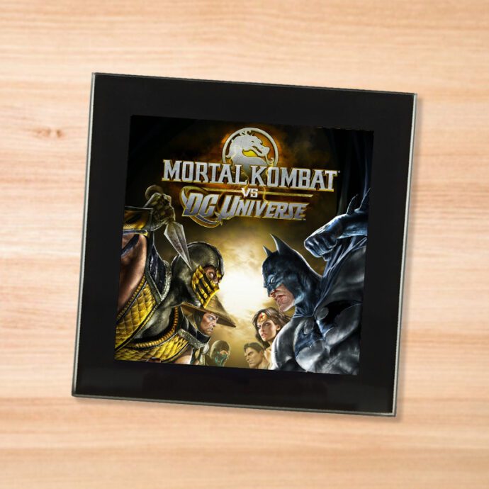 Black glass Mortal Kombat vs DC Universe coaster on a wood table