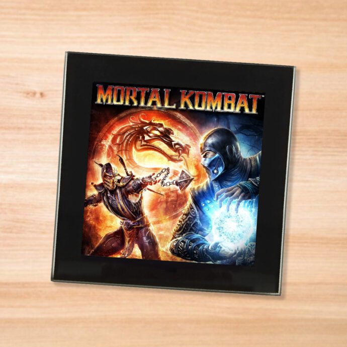 Black glass Mortal Kombat 9 coaster on a wood table