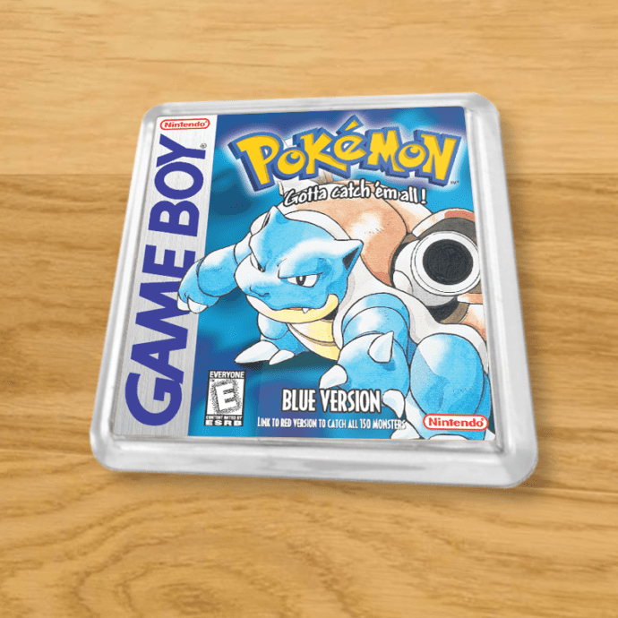 Pokemon Blue plastic coaster on a wood table