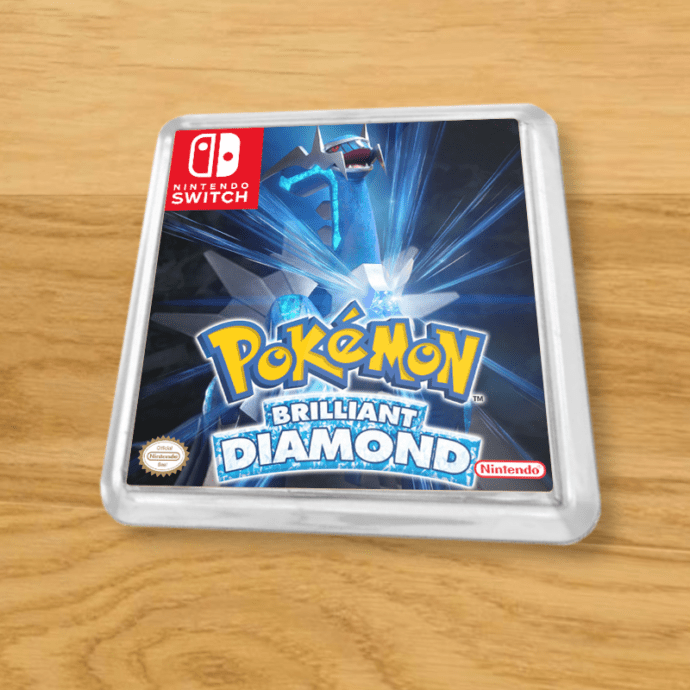 Pokemon Brilliant Diamond plastic coaster on a wood table