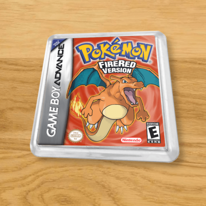 Pokemon Fire Red plastic coaster on a wood table
