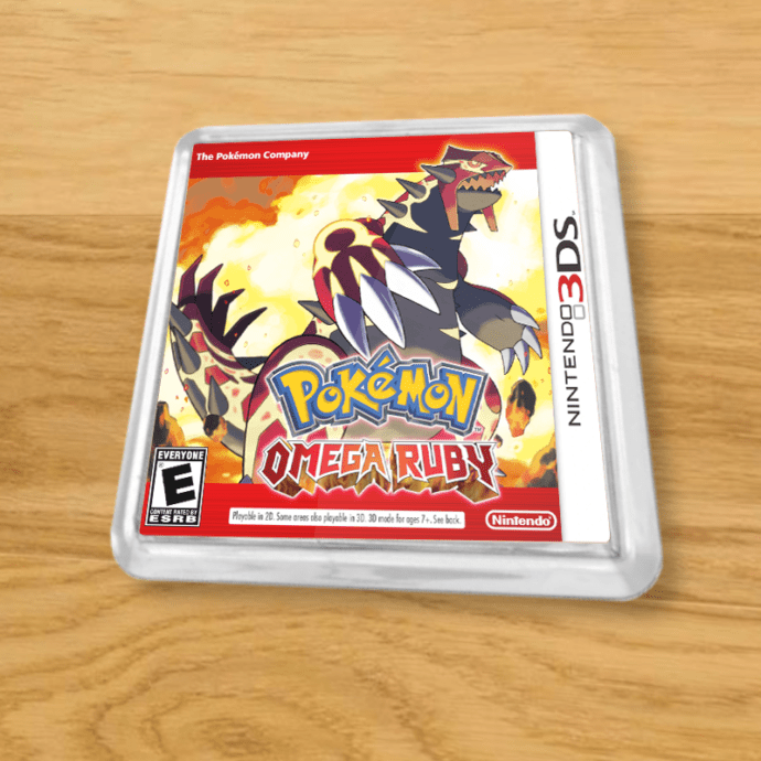 Pokemon Omega Ruby plastic coaster on a wood table
