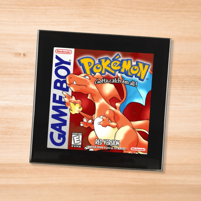 Pokemon Red black glass coaster on a wood table