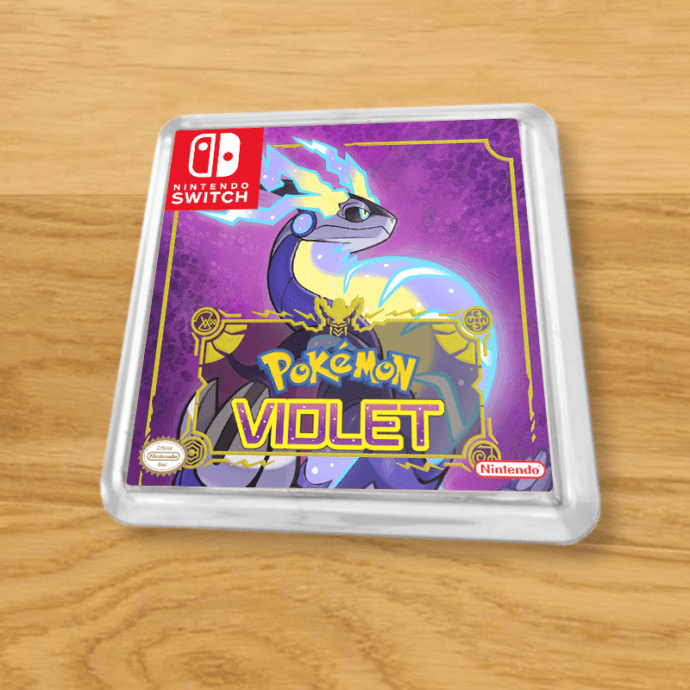 Pokemon Violet plastic coaster on a wood table