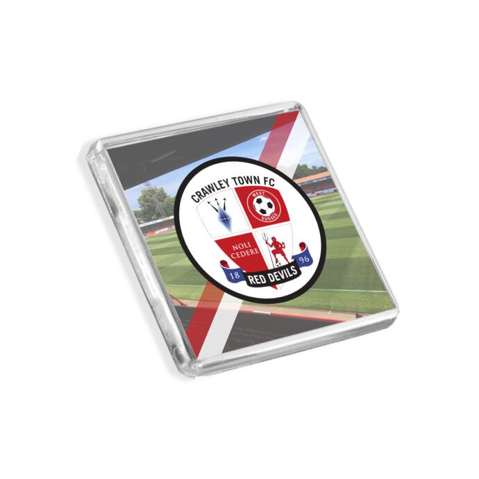 Plastic Crawley Town fridge magnet on a white background