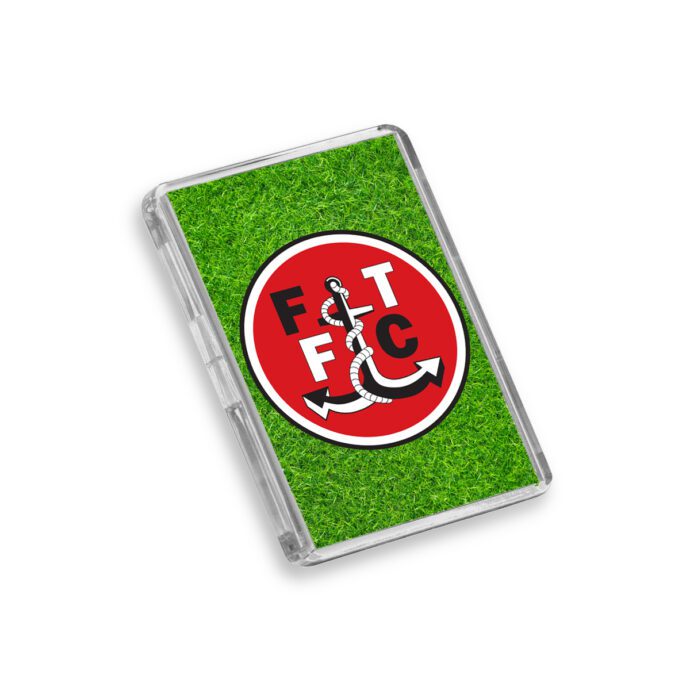 Plastic Fleetwood Town fridge magnet on a white background