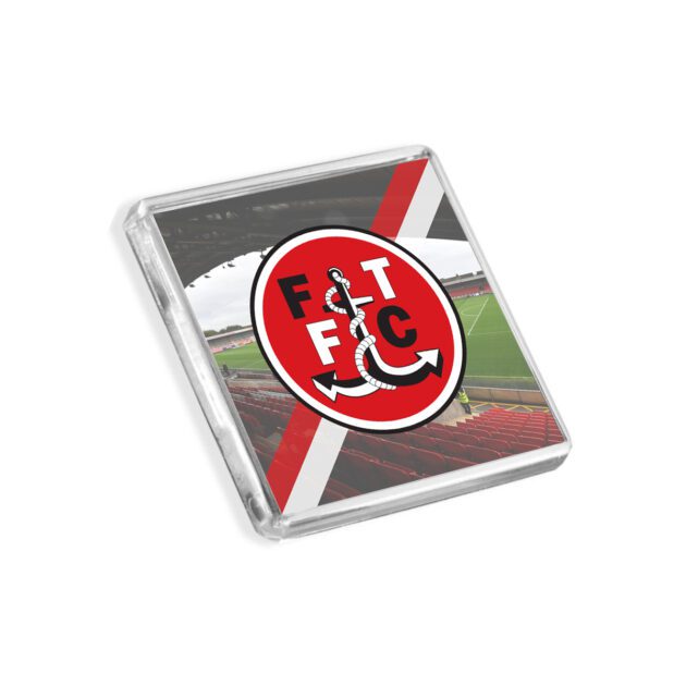 Plastic Fleetwood Town fridge magnet on a white background