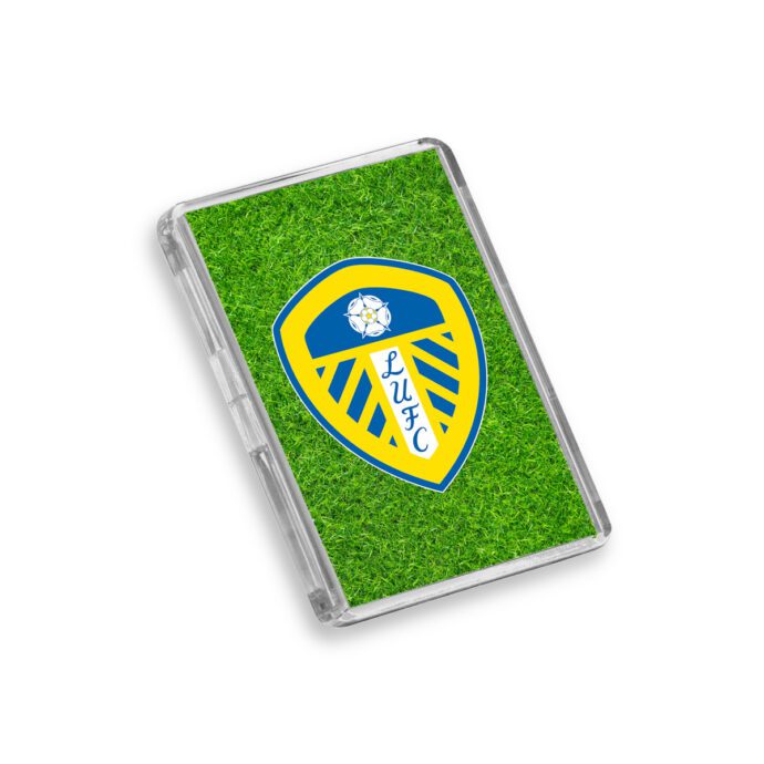 Plastic Leeds United fridge magnet on a white background