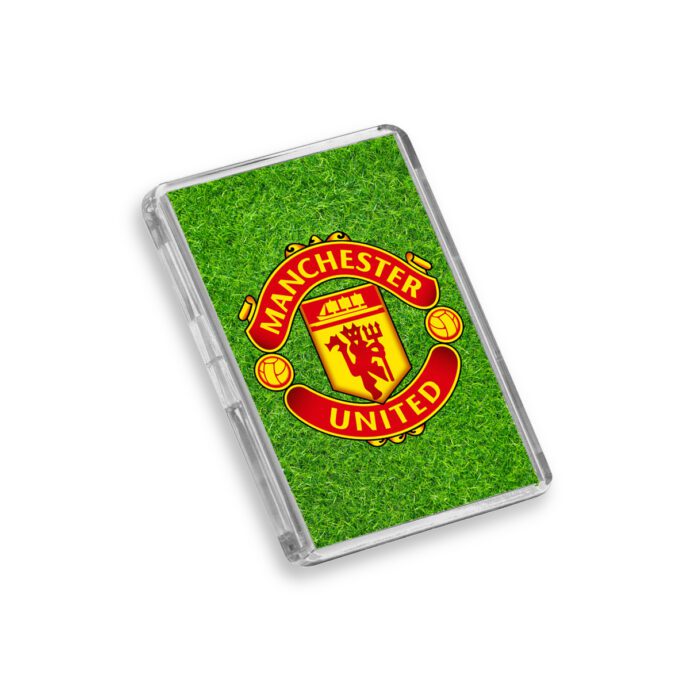 Plastic Manchester United fridge magnet on a white background