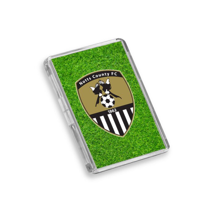 Plastic Notts County fridge magnet on a white background