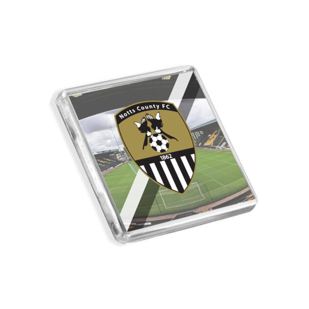 Plastic Notts County fridge magnet on a white background