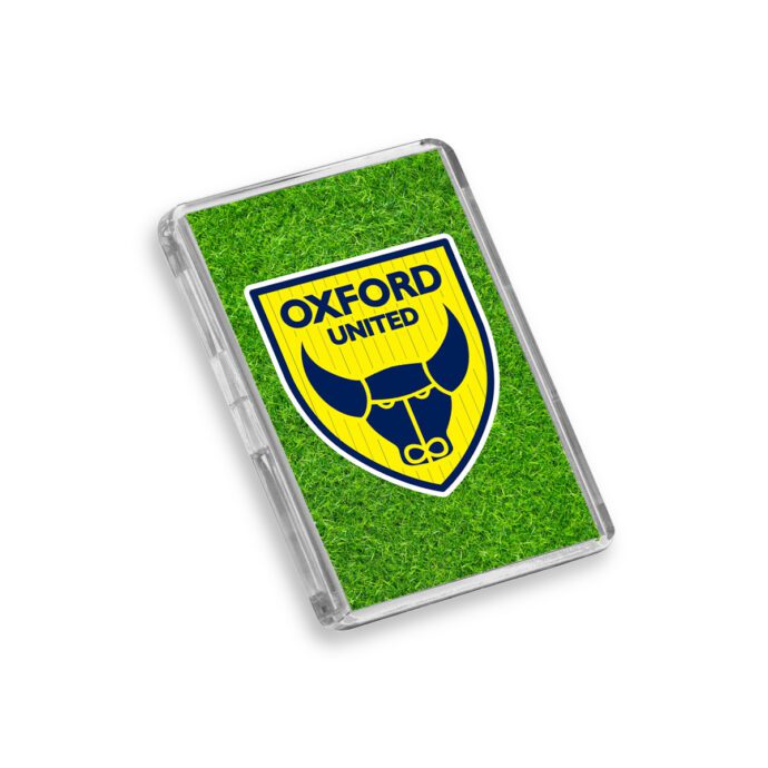 Plastic Oxford United fridge magnet on a white background