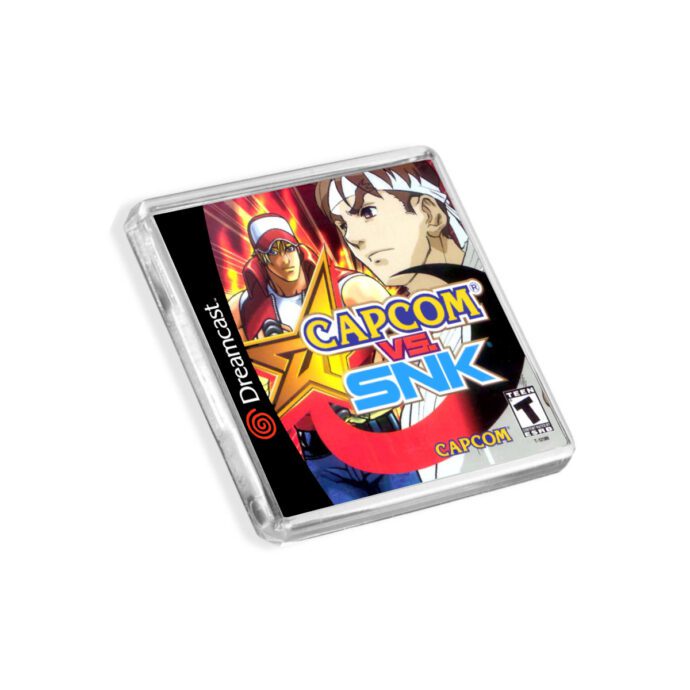 Plastic Dreamcast Capcom vs SNK fridge magnet on a white background