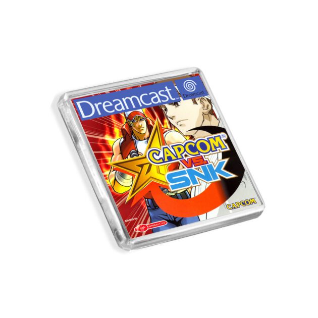 Plastic Dreamcast Capcom vs SNK fridge magnet on a white background